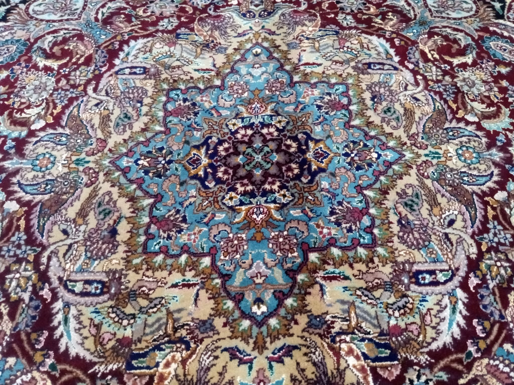 Handcrafted 8x12 Indian Tabriz rug with intricate designs and vibrant colors, showcasing traditional craftsmanship and luxurious texture, perfect for elegant home decor.