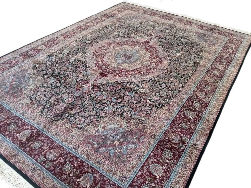 Handcrafted 8x12 Indian Tabriz rug with intricate designs and vibrant colors, showcasing traditional craftsmanship and luxurious texture, perfect for elegant home decor.