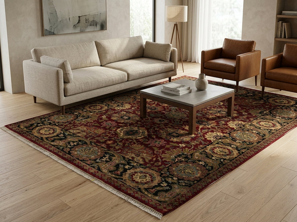 Living room with a patterned rug, sofa, and chairs.
