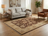 Load image into Gallery viewer, Living room with a gray sofa, brown armchair, and patterned rug.