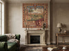Load image into Gallery viewer, Living room with a fireplace, green sofa, and decorative tapestry.