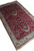 Load image into Gallery viewer, A traditional oriental area rug with a deep red field, beige and blue borders, and floral motifs, shown on a plain white background.