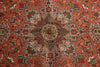 Load image into Gallery viewer, A close-up of an intricate Persian-style rug featuring a detailed central medallion and surrounding geometric floral patterns in terracotta red, beige, brown, and muted blue.