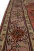 Load image into Gallery viewer, A close-up view of a traditional oriental rug showing its detailed pattern and color palette, featuring a dusty pink field with a central brown medallion and cream borders.