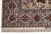 Load image into Gallery viewer, A close-up of an ornate Persian-style area rug showing the corner, detailed floral and bird motifs, cream background, and fringed edge.