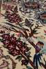 Load image into Gallery viewer, Close-up of a woven rug with a cream background and an ornate floral and bird pattern in red, blue, green, brown, and beige.