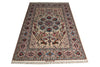 Load image into Gallery viewer, A traditional oriental area rug with an intricate floral and geometric pattern, featuring a central medallion, detailed borders, and fringe on the ends, shown against a plain white background.