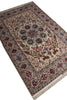 Load image into Gallery viewer, A traditional oriental area rug with an intricate floral and geometric pattern, shown from an angled overhead perspective on a white background.
