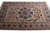 Load image into Gallery viewer, A traditional oriental area rug with an intricate floral and geometric pattern, featuring a central medallion and multiple borders in beige, blue, red, and green tones.