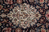 Load image into Gallery viewer, A close-up of an ornate Persian-style area rug featuring a large central medallion with intricate floral and bird motifs on a dark navy blue background.