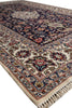 Load image into Gallery viewer, A traditional oriental area rug with an intricate floral and medallion pattern, featuring a dark navy blue field, cream borders, and red, green, and gold accents, shown on a white background.