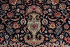 Load image into Gallery viewer, A close-up of an ornate woven textile or rug pattern with a central floral medallion and surrounding paisley-style motifs on a very dark navy or black ground. The design includes cream, beige, muted red, pink, and gold-toned details.