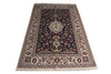 Load image into Gallery viewer, A traditional oriental area rug with an intricate floral pattern, featuring a dark navy blue center field, cream borders, and multicolored floral motifs, shown flat against a white background.