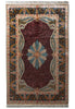 Load image into Gallery viewer, A traditional rectangular area rug with a deep burgundy central field, a large blue and beige floral medallion, and an ornate navy, beige, and gold patterned border with fringe on the top and bottom.