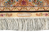 Load image into Gallery viewer, Close-up of a patterned rug showing ornate floral and scroll motifs in beige, brown, black, blue, green, and pink, with a cream fringe along the bottom edge.
