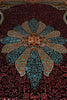 Load image into Gallery viewer, A close-up of an ornate Persian-style rug featuring a large central floral medallion in teal, gold, and red, surrounded by a dark red and black floral patterned field.
