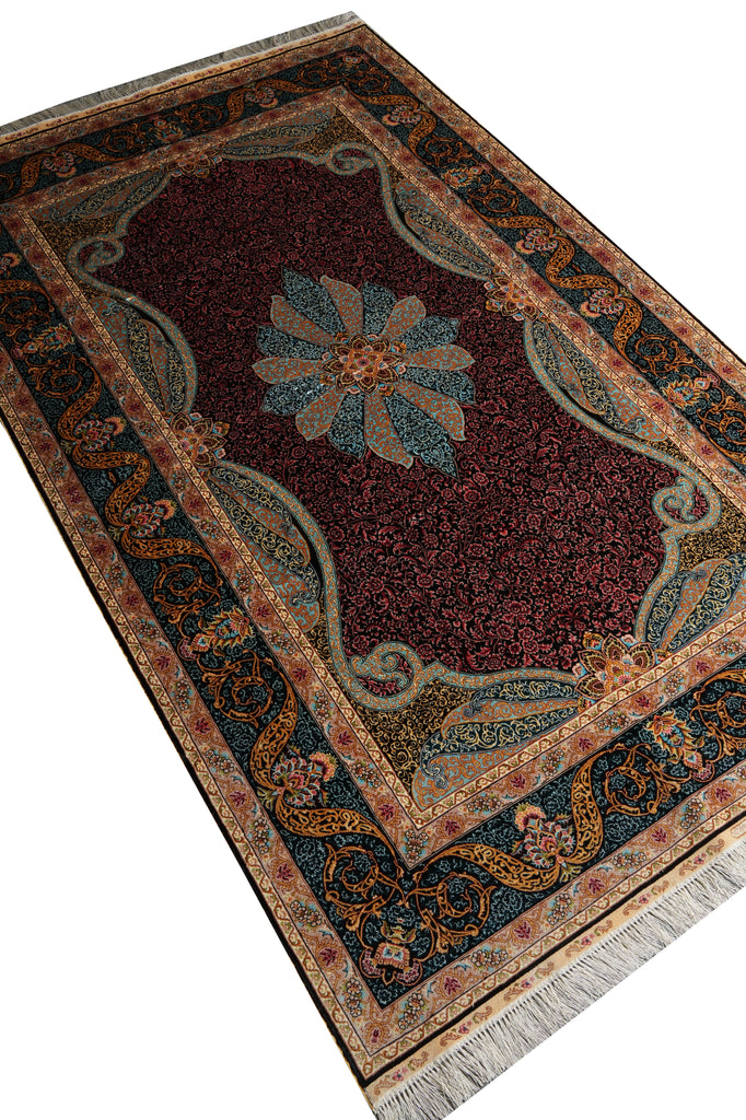 A rectangular traditional area rug with a dark red central field, a large floral medallion in muted blue and beige, and an ornate border in navy, gold, and cream, shown on a white background.