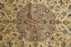 Load image into Gallery viewer, A close-up of an ornate patterned rug with a central medallion design in beige, brown, blue, and muted green tones.