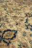 Load image into Gallery viewer, Close-up of an ornate floral area rug with a cream background and intricate patterns in navy blue, beige, brown, and muted green.