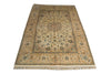 Load image into Gallery viewer, A rectangular traditional area rug with an intricate floral and medallion pattern, featuring a beige and cream base with blue, green, and brown accents, finished with a fringed edge.