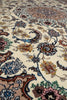 Load image into Gallery viewer, Close-up of an ornate traditional patterned rug with cream background and floral motifs in blue, pink, brown, green, and gold.