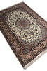 Load image into Gallery viewer, An oriental area rug with a traditional floral pattern, featuring a central medallion, ornate borders, and fringed edges, shown on a plain white background.