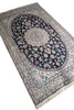Load image into Gallery viewer, A rectangular Persian-style area rug with a central medallion and intricate floral motifs, shown from an elevated angle on a white background.