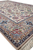 Load image into Gallery viewer, A traditional Persian-style area rug with an intricate floral pattern, featuring a cream center field, beige borders, and multicolored details including blue, red, and green, finished with a fringed edge.
