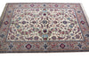 Load image into Gallery viewer, A traditional Persian-style area rug with an intricate floral and vine pattern, featuring a cream center field, detailed multicolor borders, and small fringe on the top and bottom edges.