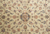 Load image into Gallery viewer, A close-up of an ornate Persian-style rug with a cream background and intricate floral motifs in dusty pink, blue, and brown.