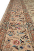 Load image into Gallery viewer, A close-up view of a traditional oriental rug with a beige background and an intricate floral pattern in shades of blue, pink, brown, and green.