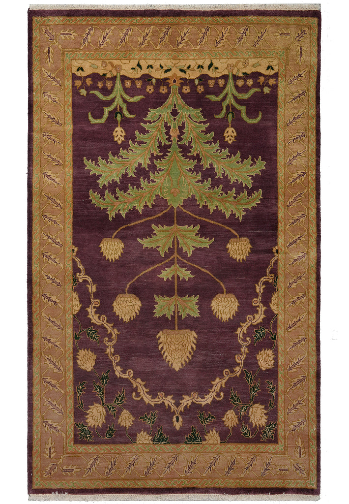 A rectangular area rug with a traditional botanical design, featuring a deep purple center field with a large green and gold hollyhock motif, surrounded by a wide gold and brown patterned border.