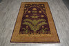 Load image into Gallery viewer, A rectangular area rug with a traditional botanical pattern, featuring a dark plum purple center, olive green thistle motifs, and a warm gold and brown border, laid out on a gray wood-look floor.