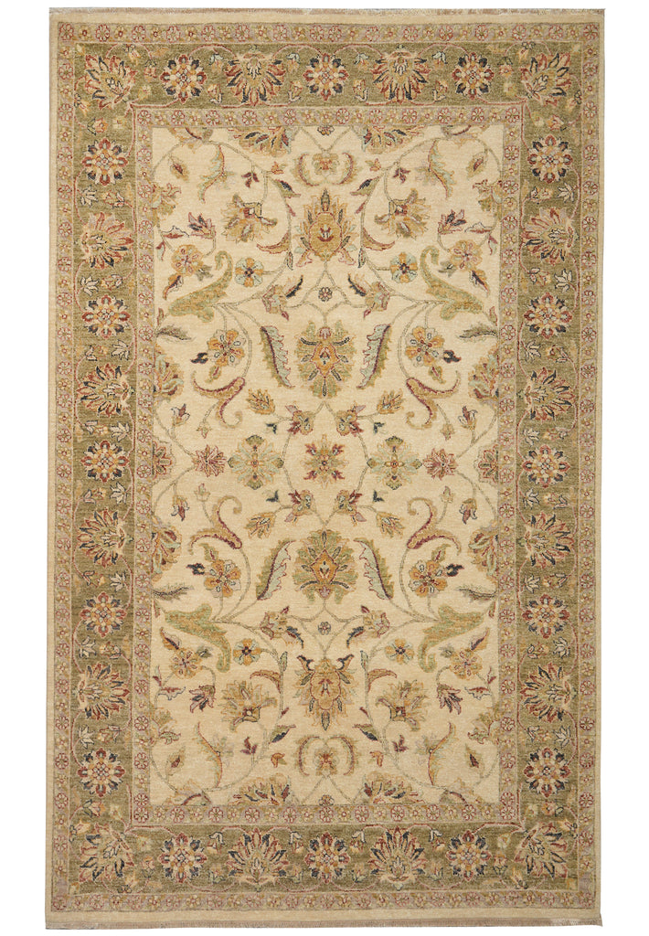A traditional oriental-style area rug with an intricate floral and scroll pattern, featuring a cream center field and a beige border with muted green, gold, and red accents.