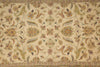 Load image into Gallery viewer, An ornate vintage-style area rug with a cream background and a detailed floral and scroll pattern in muted green, gold, and terracotta tones.