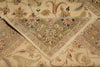 Load image into Gallery viewer, A close-up of a folded patterned rug showing its intricate floral and paisley design in beige, olive green, and muted red tones.