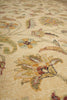 Load image into Gallery viewer, Close-up of a textured area rug with a floral pattern in beige, yellow, green, and red tones.