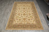 Load image into Gallery viewer, A rectangular traditional area rug with an ornate floral and vine pattern, displayed on a gray wood-look floor.