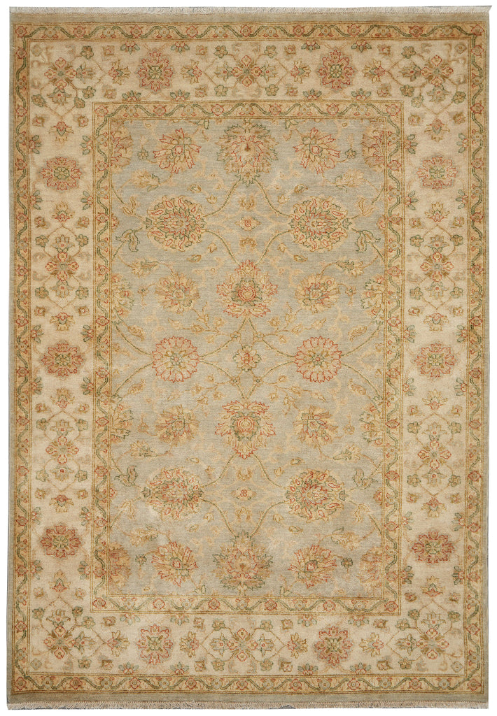 A rectangular area rug with an intricate traditional floral pattern in muted beige, cream, sage green, and soft terracotta tones.