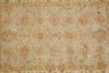 Load image into Gallery viewer, An ornate traditional area rug with a floral pattern in muted tones of beige, dusty blue, and terracotta red.