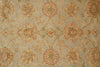 Load image into Gallery viewer, A close-up of a woven textile or rug pattern with a repeating floral motif in muted red, beige, and green on a light gray-beige ground.