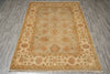 Load image into Gallery viewer, A rectangular area rug with an intricate traditional floral pattern, displayed flat on a gray wood-look floor.