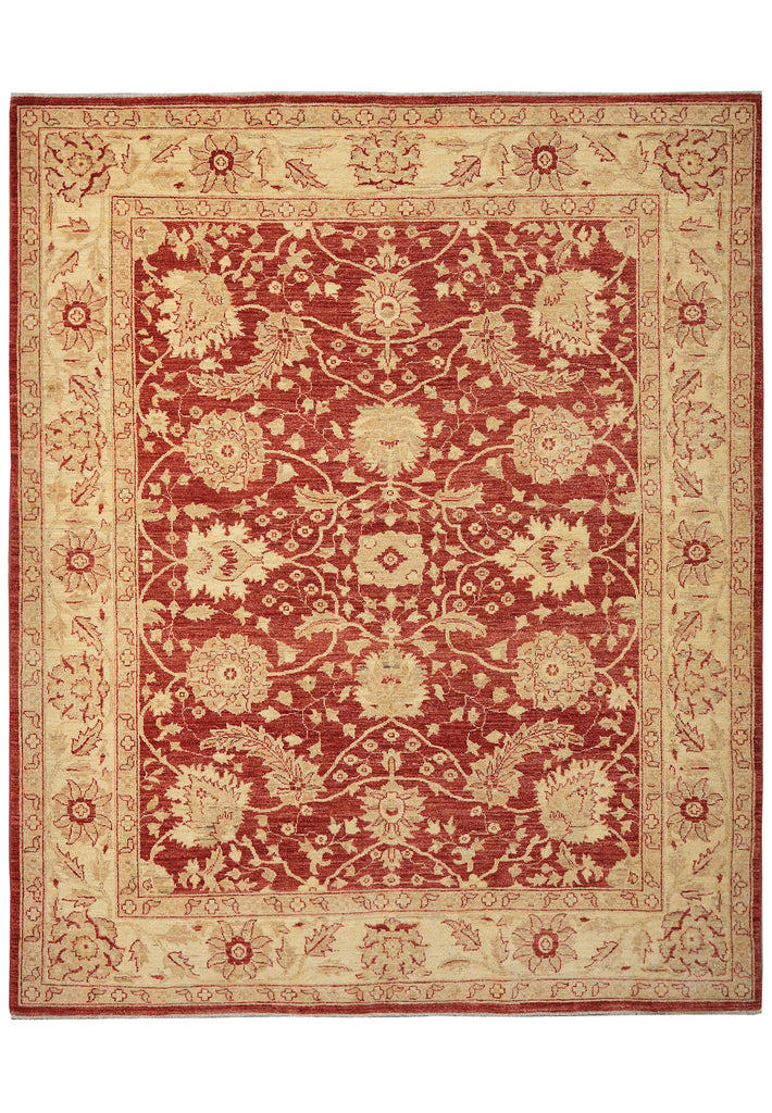A traditional rectangular area rug with an ornate floral and vine pattern, featuring a deep red center field and a warm beige border.