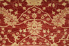 Load image into Gallery viewer, A close-up of a traditional patterned rug featuring a deep red background with beige floral and botanical motifs.
