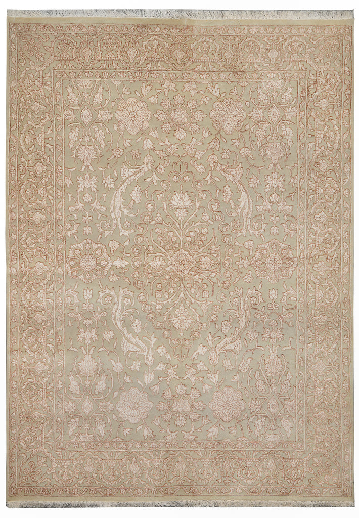 An area rug with an intricate traditional floral pattern in muted beige, dusty pink, and sage green tones, featuring a central medallion and corner motifs.