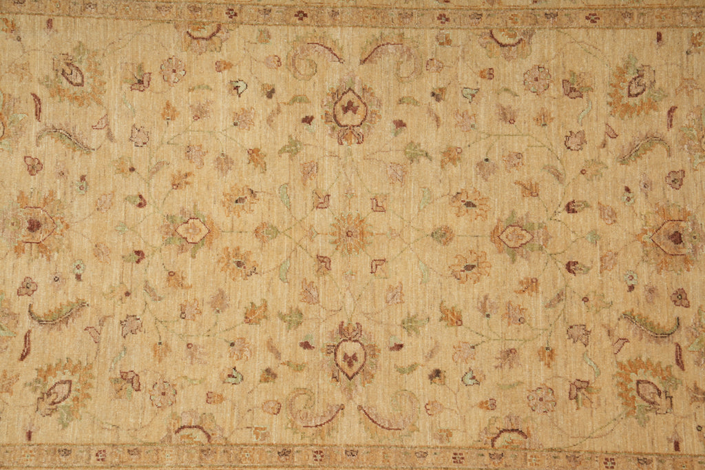 A square area rug with an intricate traditional floral pattern in beige, tan, brown, and muted green tones.