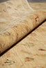 Load image into Gallery viewer, A close-up of a rolled area rug showing its textured, low-pile surface with a subtle beige and tan floral pattern.