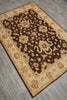 Load image into Gallery viewer, A rectangular area rug with a traditional floral pattern, featuring a dark brown center and a beige border, laid out on a gray wood-look floor.