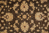 Load image into Gallery viewer, A close-up of an ornate floral patterned rug with a dark brown background and beige, tan, and muted red motifs.