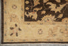 Load image into Gallery viewer, Close-up of an ornate traditional rug corner showing a cream and dark brown floral pattern with a decorative border and small fringe.